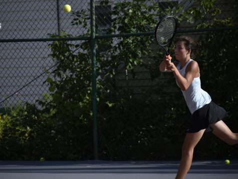 Margaret Bugnacki, senior, hits the ball. Girls tennis has a large turnout this year.