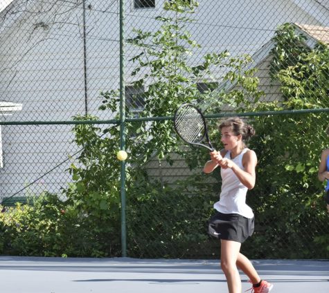 Margaret Bugnacki, senior, slams the ball at a recent practice. Bugnacki has been aiming for state since sophomore year and hopes to continue playing in college.