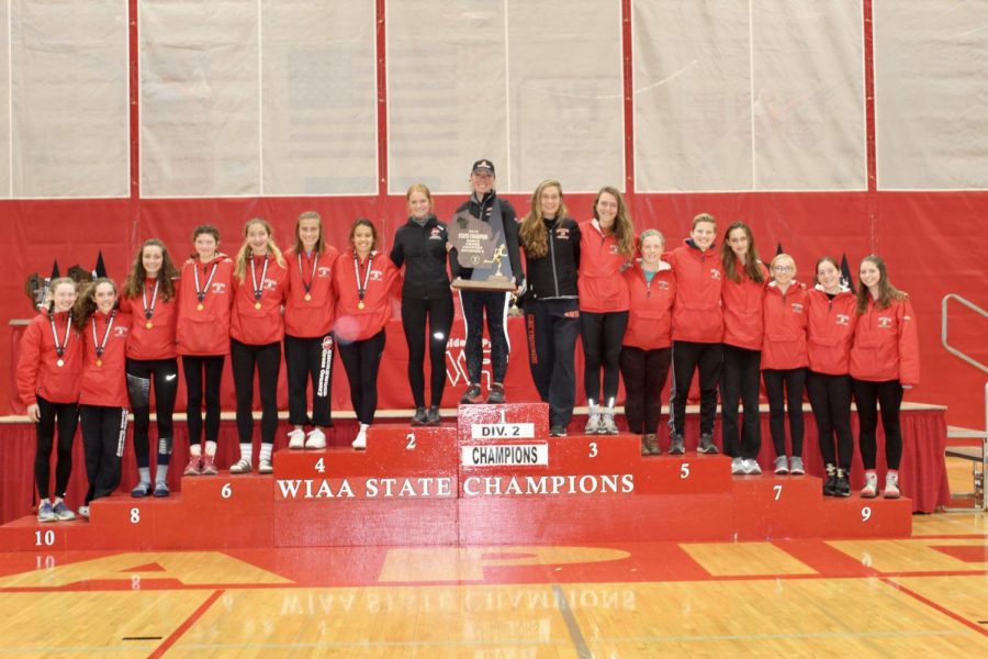 The team stands on the state podium. This was the first win in program history.