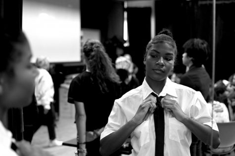 Trinity Higgins, senior, gets ready backstage before the performance begins.