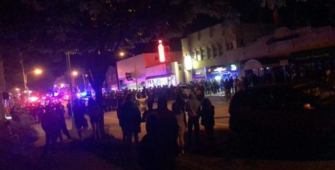 A police line of officers in riot gear block N. Oakland Ave. This line is south of where heavy law enforcement teams were placed on the corner of Edgewood and Oakland.