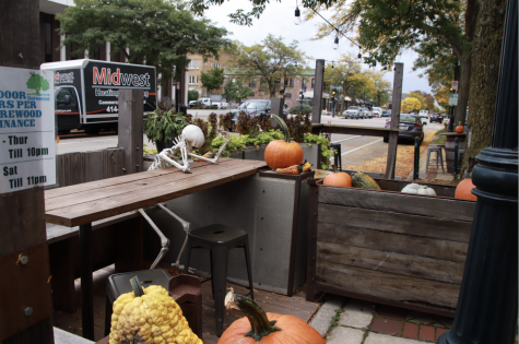 A skeleton bows his head at an outdoor table at Draft & Vessel. The establishment, like many others, is wondering how they will safely serve customers as the chillier months approach.