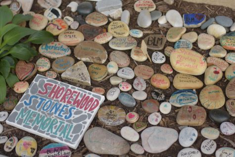 Decorated stones lay scattered at the rock garden exhibit next to MOD Pizza. The event was held to create a space for conversations on race mediated through art.