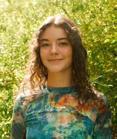 Lindsay Nelsen, SHS class of 2020, poses in her garden at her house in Shorewood, which is where she's had to take her classes from this semester. Nelsen is a theater arts major, which has provided unique challenges during COVID.