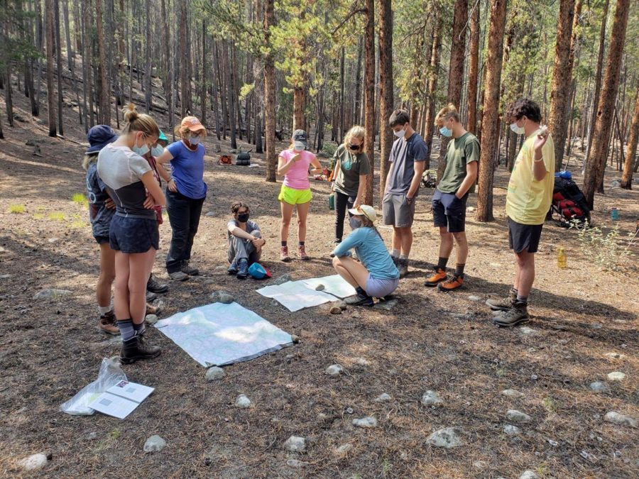 Juliet Peterka, junior, learns how to read maps with her classmates while backpacking. First semester, Peterka attended High Mountain Institute in Colorado, which provides various outdoor experiences for students.
