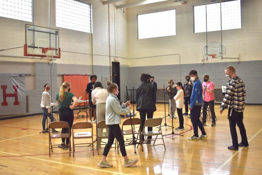 Students rehearse for the spring musical, Working, in the North Gym. There are a total of 14 cast members in the production, which will be filmed over the course of two weeks.