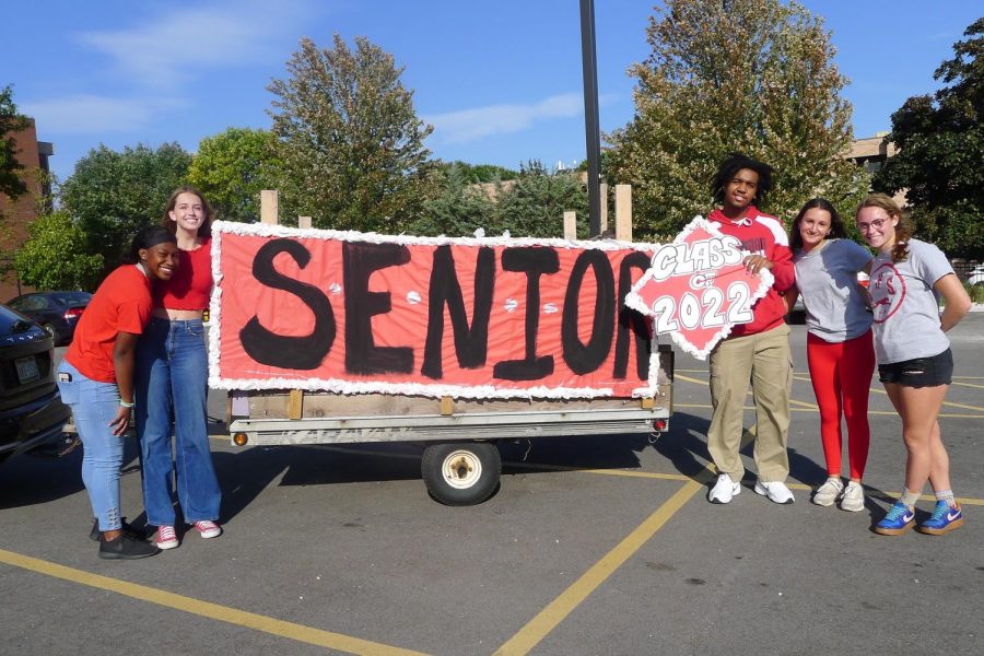 Seniors pose with their Homecoming parade float. After it was cancelled in 2020, most Homecoming festivities were put on this year.