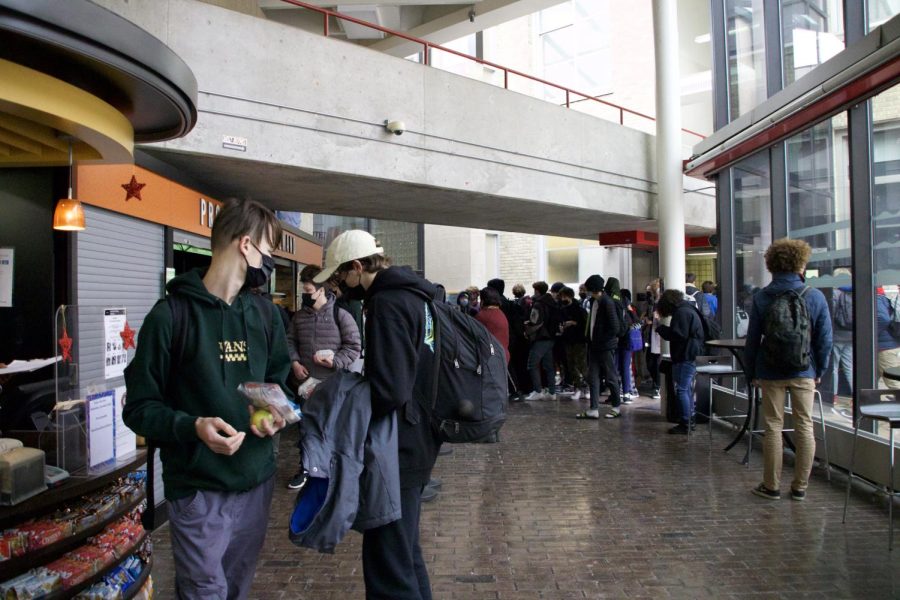 Students wait in line to get food from Provisions On Demand (POD). The long wait times are one of the main concerns of students.