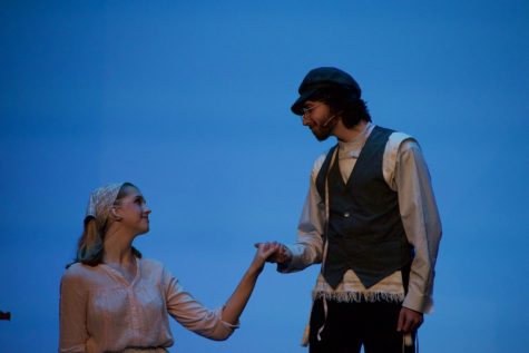 Zahni Gulbronson (right) and Madeline Pluckhan (left) hold on a scene of Fiddler on the Roof. The musical was the last production for many seniors in SHS Drama.