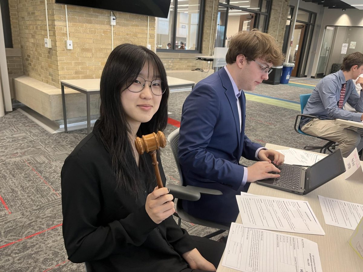 Juniors Dana Kim, chairperson (left), and Erich Lotter, speaker of the house (right) prepare their speeches.